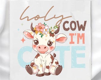 May include: Square white card featuring a cartoon cow with a floral crown. The cow has brown spots and large eyes. Text reads "Holy Cow I'm Cute" in various colors and fonts. Decorative stars and a light blue "C" and "TE" complete the design.