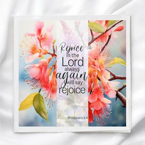May include: Square card featuring watercolor art of pink flowers and green leaves. Text reads "Rejoice in the Lord always again will say rejoice" with "Philippians 4:4" below.