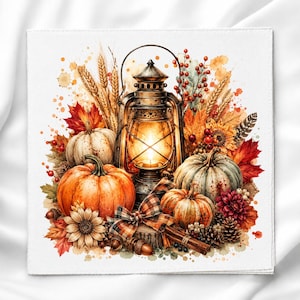 May include: A square print featuring a central metal lantern glowing with light, surrounded by orange and white pumpkins, wheat stalks, red berries, autumn leaves, a plaid bow, pinecones, cinnamon sticks, and sunflowers in a watercolor style.
