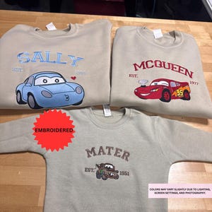 three t-shirts with different cartoon car designs and text, including the names Sally and Queen.