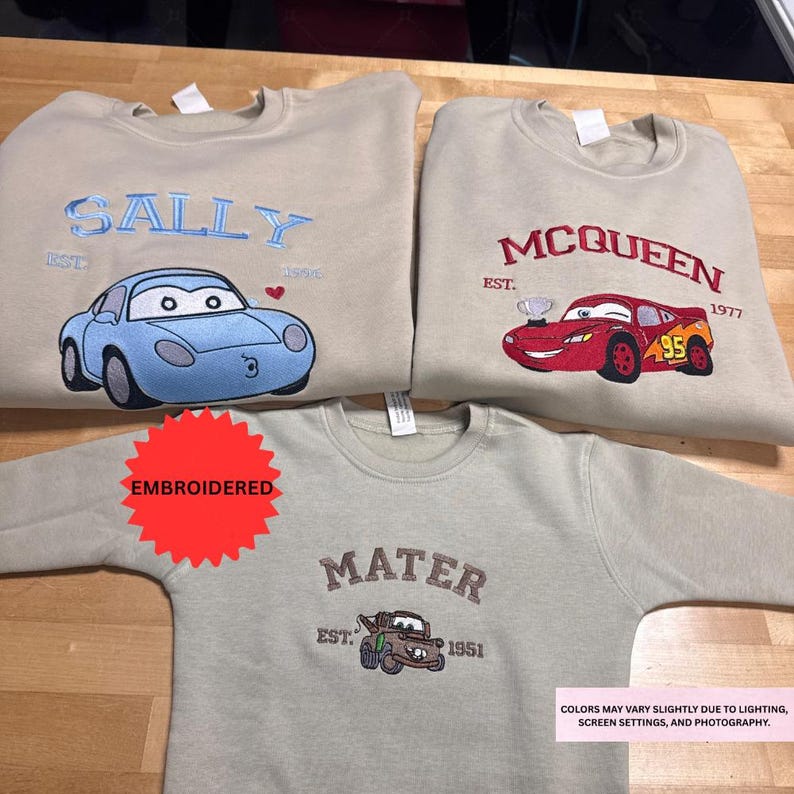 three t-shirts with different cartoon car designs and text, including the names Sally and Queen.