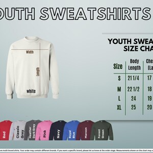 The image is a size chart for youth sweatshirts, displaying the measurements for different sizes. It includes a white sweatshirt and a variety of colored sweatshirts, along with the corresponding size labels.