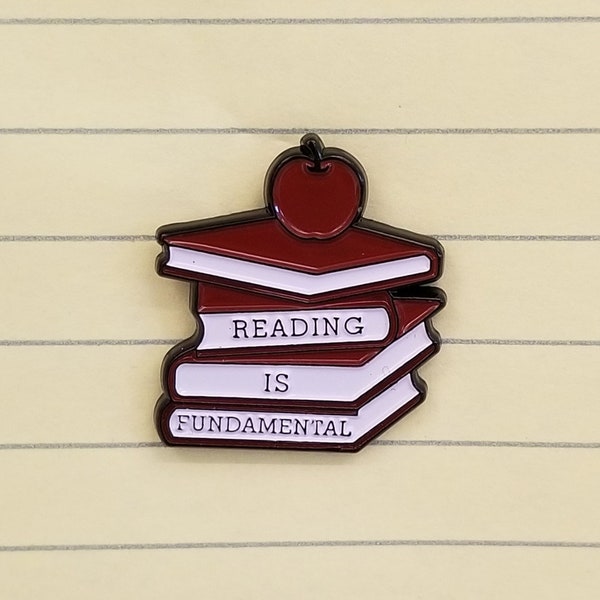 Reading is Fundamental enamel pin benfitting NYC Books Through Bars