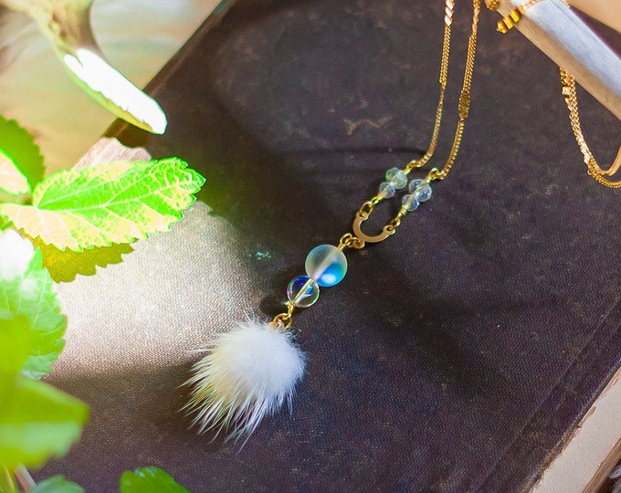 white faux fur pompom necklace with iridescent rainbow glass beads