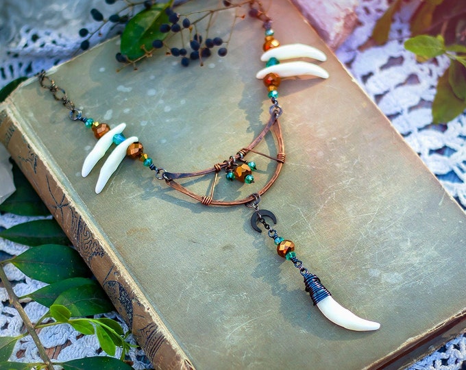 hammered copper half-moon necklace with coyote teeth
