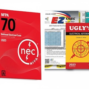 May include: A collection of electrical reference books. The main book is red with the text "NFPA 70 National Electrical Code 2023". Other books include "EZ Tabs" and "Ugly's Electrical References 2023 Edition".