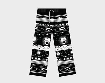 May include: Black and white lounge pants featuring a repeating pattern of cartoon bear characters, musical notes, and geometric shapes. The pants have an elastic waistband with a white drawstring and a GMMTV logo in the top right corner.