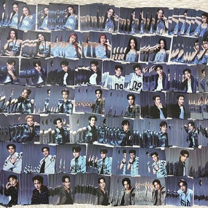 May include: A collection of trading cards featuring various individuals in denim outfits and formal wear. The cards are arranged in a grid pattern, showcasing a variety of poses and expressions. The overall color scheme is cool-toned, with shades of blue and gray.