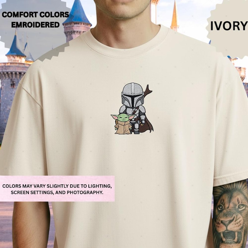 A person wearing a white t-shirt with a graphic of a character and a smaller character, likely representing the Star Wars universe, on the front.