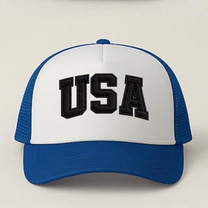 A white and blue baseball cap with the word "USA" printed on it.