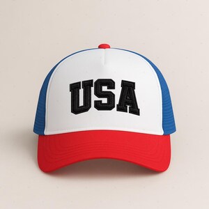 A white and red baseball cap with the word "USA" printed on it.
