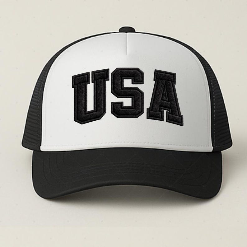 A black and white baseball cap with the word "USA" printed on it.