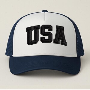 A white and navy blue baseball cap with the word "USA" printed on it.