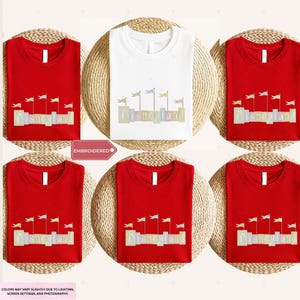 a collection of red t-shirts with the word "Disneyland" printed on them, arranged in a grid pattern.