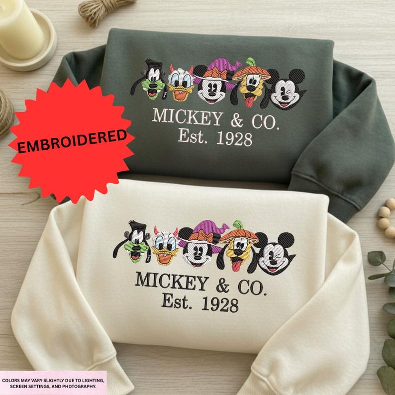 two sweatshirts with a Mickey Mouse and Co. logo, along with text that reads "EMBRODERED MICKEY & CO. Est. 1928".