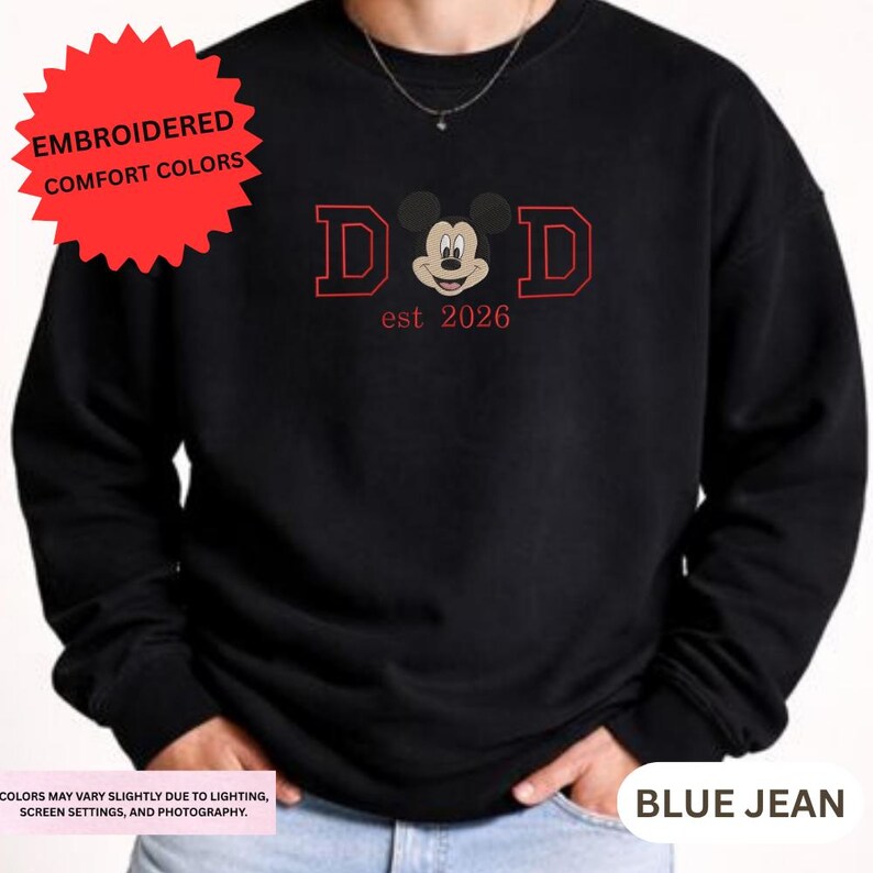 A black sweatshirt with a red and white design featuring a cartoon character and text.