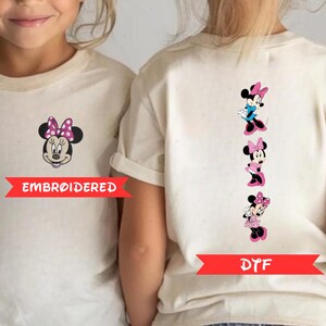 two white t-shirts with Minnie Mouse designs on the back. The t-shirt on the left is embroidered with Minnie Mouse, while the t-shirt on the right has a series of Minnie Mouse images arranged vertically.