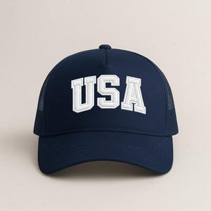A navy blue baseball cap with the word "USA" printed in white letters.