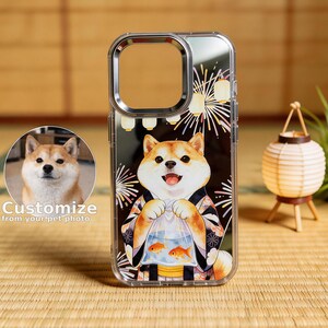 May include: Transparent phone case with a Shiba Inu dog illustration. The dog is wearing a kimono and holding a bag with goldfish, set against a black backdrop with fireworks and lanterns. The text "Customize from your pet photo" is visible.