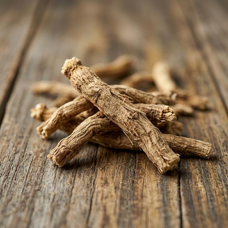May include: A small pile of dried, light brown ginseng roots with a rough, fibrous, and wrinkled texture. The roots are cylindrical, woody, and have a tapered shape with small rootlets and nodes visible along their length.