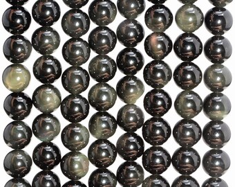 May include: A strand of black obsidian beads with a shimmering, iridescent effect. The beads are round and smooth, and they are arranged in rows.