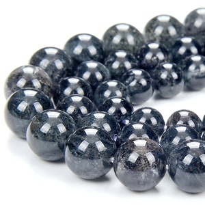 May include: A strand of dark blue gemstone beads. The beads are round and have a smooth, polished finish.