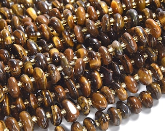 May include: A strand of brown and gold tiger's eye beads. The beads are oval shaped and have a smooth, polished finish.