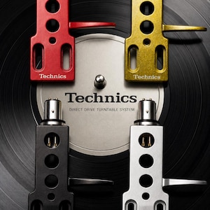 May include: Four Technics turntable headshells in red, gold, black, and silver, set against a black vinyl record. The Technics logo and "DIRECT DRIVE TURNTABLE SYSTEM" are displayed. The PF Audio Solutions logo is also present.