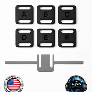 May include: Six black rectangular plastic components with two horizontal slots each, labelled with the letters A through F. Below these is a single grey T-shaped component with a central U-shaped cutout. Includes Proudly Made in USA and PF Audio logos.