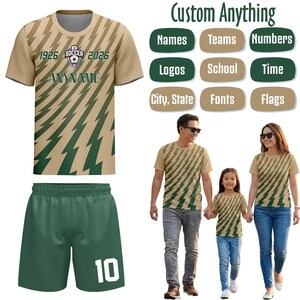 May include: A tan and green soccer kit with a lightning bolt pattern. The jersey has the text "ANYNAME". The green shorts have the number 10. The image also shows a family wearing matching shirts with the same design.