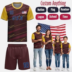 May include: A maroon and gold football kit featuring "USA" and the number "10" in blue, with the American flag. The image also shows a family wearing matching shirts with the American flag in the background. Text reads "Custom Anything".