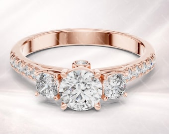 Anillo de promesa de oro rosa con tres diamantes de talla redonda