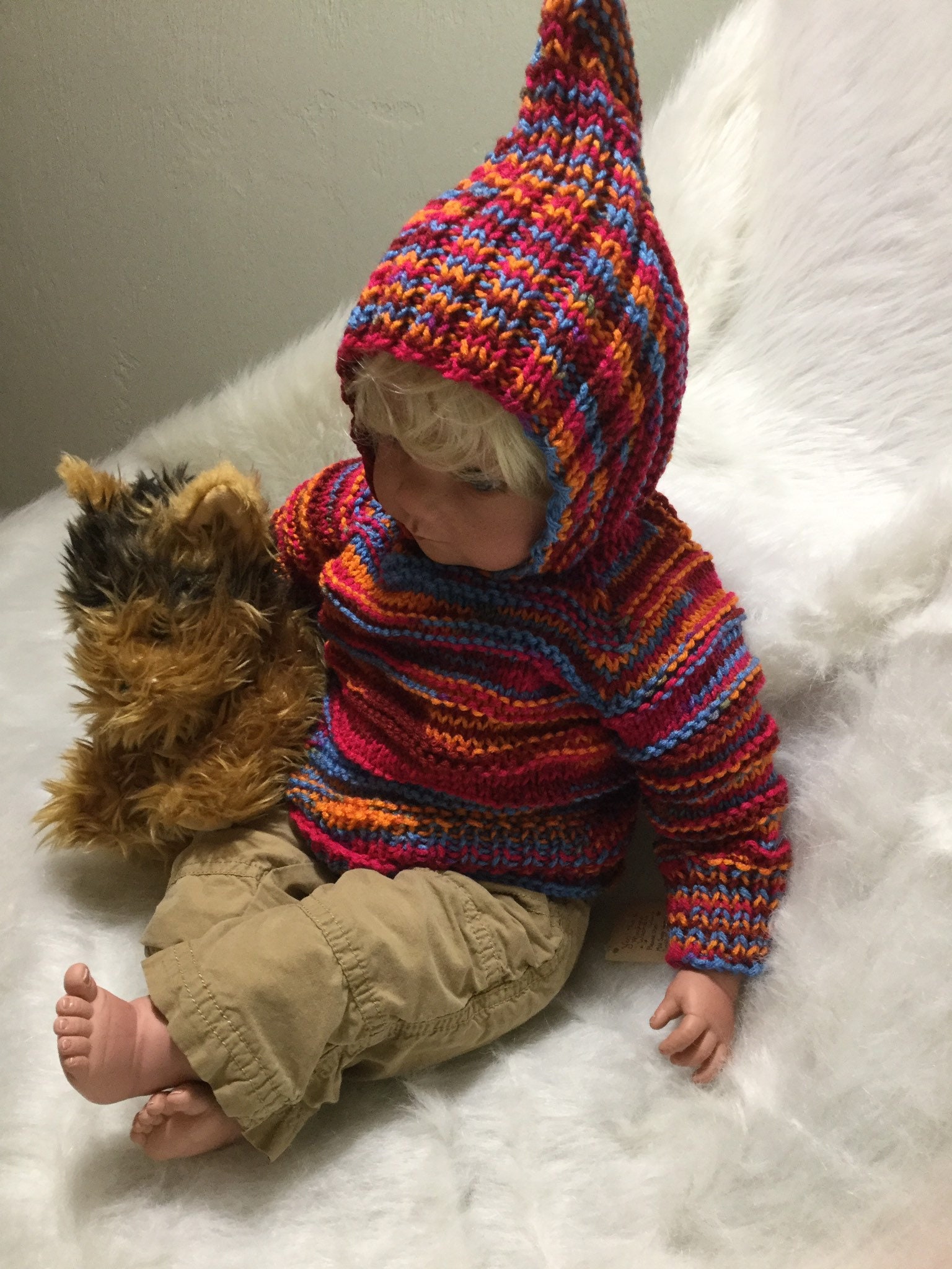 Hand knit hooded baby sweater zips up the backso cute & practical