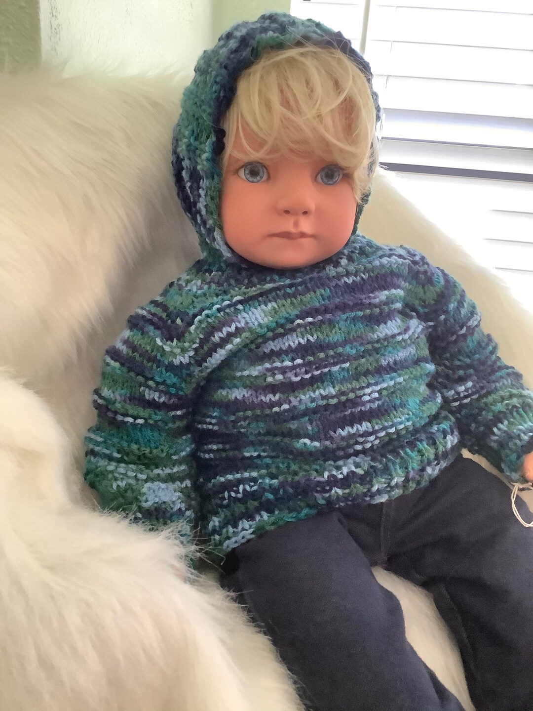 Hand knit hooded baby sweater zips up the backso cute & practical