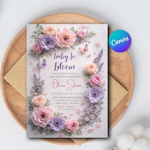 May include: A baby shower invitation with the text "Baby In Bloom" surrounded by floral and butterfly illustrations. The invitation includes the honoree's name, date, time, and location. The invitation is on a wooden tray with an envelope.