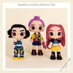 May include: Three handmade crochet dolls with detailed features, including black, purple, and pink hair. Each doll is dressed in colourful outfits with intricate designs. The text "Huntrix Crochet Pattern Trio" is at the top.