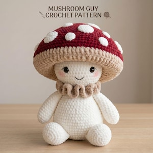 May include: A handmade crochet mushroom doll with a red and white spotted cap, beige stem, and white body. The doll has a smiling face with rosy cheeks and a ruffled collar. The text "MUSHROOM GUY CROCHET PATTERN" is at the top.