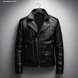 May include: Black leather jacket with a snakeskin pattern, featuring an asymmetrical zipper closure, a notched collar, and multiple zippered pockets. The jacket is hanging on a black hanger against a gray background.