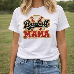 May include: White t-shirt with a baseball-themed design. The design features a baseball graphic with the words "Baseball MAMA" in black and red lettering. The shirt is made of a soft material and is suitable for casual wear.