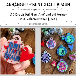 Könnte beinhalten: Eine Sammlung runder 3D-gedruckter Anhänger mit dem Text BUNT STATT BRAUN in verschiedenen Farbkombinationen, darunter Pink, Blau, Schwarz, Weiß und Lila, mit angehängten herzförmigen Charms und Metallkugelketten zum Aufhängen.