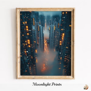 Puede incluir: Una impresión enmarcada que muestra una ciudad por la noche. Vista aérea de edificios altos con ventanas y letreros iluminados. Una capa de niebla u oscuridad en el medio. La impresión está en un marco dorado. El texto "Moonlight Prints" está en la parte inferior.