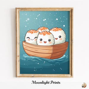 May include: A framed print featuring a whimsical illustration of four smiling sushi characters in a wooden boat, set against a blue background with white speckles. The sushi has orange toppings. The print is framed in a gold-colored frame. The text "Moonlight Prints" is at the bottom.