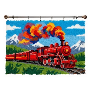 May include: A colourful, handmade wall hanging depicting a red train with vibrant smoke against a blue sky with white clouds and snow-covered mountains. The train is on a track, with green grass and trees in the foreground. The artwork is attached to a decorative rod.