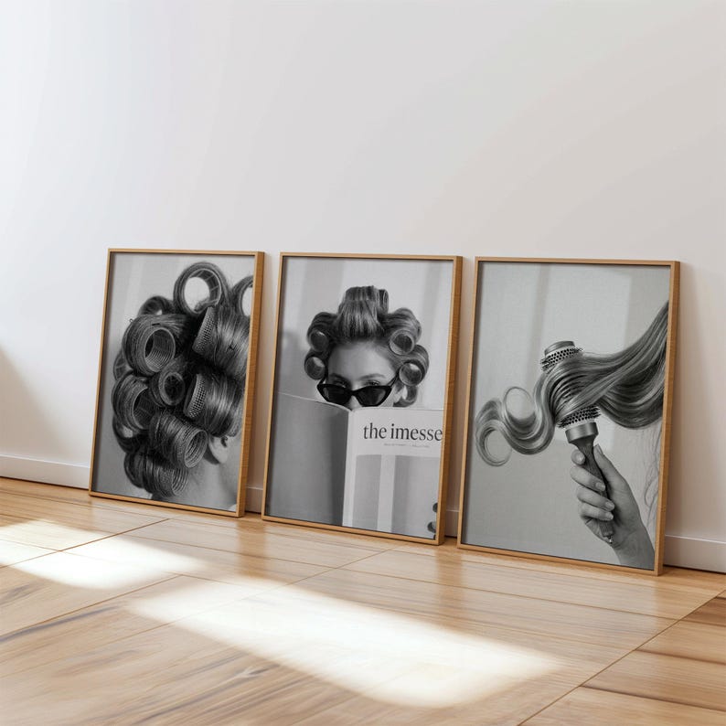May include: Set of three framed black and white prints. One print shows a woman with hair curlers, another shows a woman wearing sunglasses reading a magazine with the text "the imesse", and the third shows a person using a round brush on long hair.