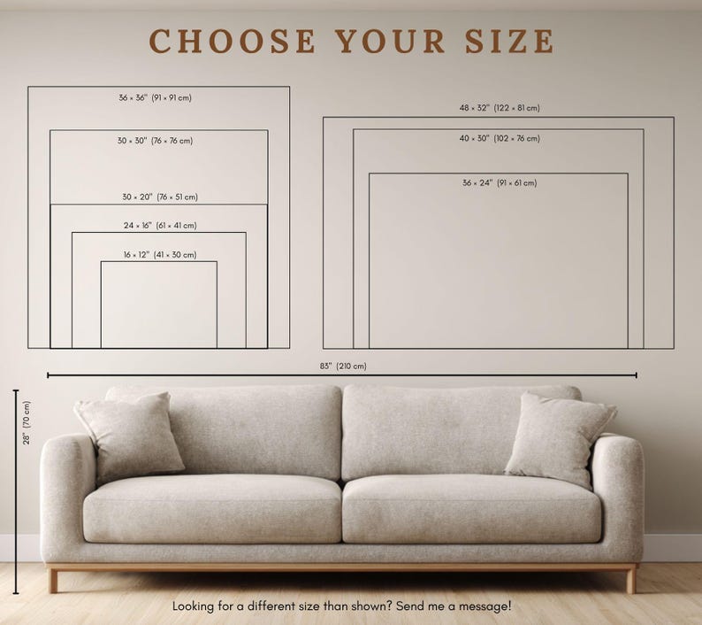 May include: A beige sofa with two cushions positioned below a wall chart titled CHOOSE YOUR SIZE. The chart displays various rectangular dimensions in inches and centimeters, ranging from 16x12 inches to 48x32 inches, with a sofa width of 85 inches.