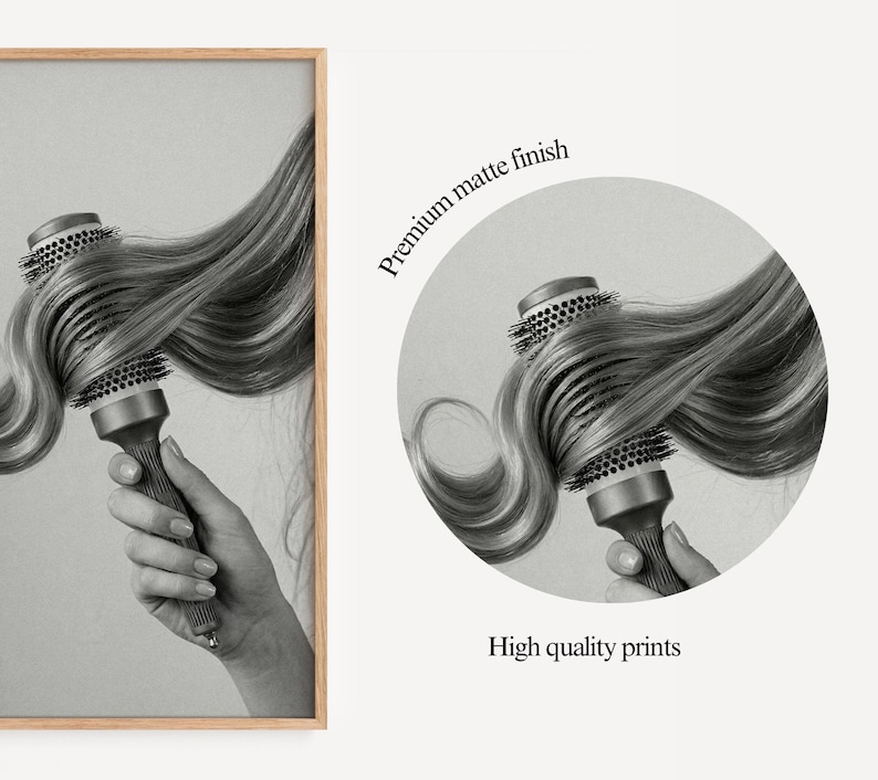 May include: Black and white print of a round hairbrush with long, wavy hair. The brush is held in a hand. The image is in a wooden frame. Text on the right says "Premium matte finish" and "High quality prints."