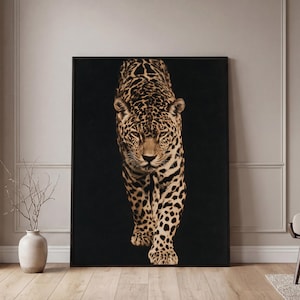 May include: A rectangular wall art print featuring a forward-facing leopard with a tan and black spotted coat. The leopard is depicted against a solid black background, captured in a realistic style with detailed fur texture and focused eyes.