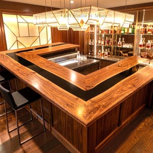 May include: An L-shaped bar counter featuring a polished wood grain surface with a central black inlay, paired with two black bar stools with metal legs. The bar is illuminated by a large rectangular pendant light fixture above the counter.