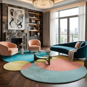 May include: A stylish living room with a teal sofa, two peach armchairs, and a round coffee table. A colourful, circular rug in shades of teal, yellow, and peach sits on a dark wood floor. A large window offers a city view.