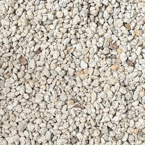 May include: A close-up of a pile of small, white, and gray stones. The stones are smooth and rounded, and they are all about the same size.